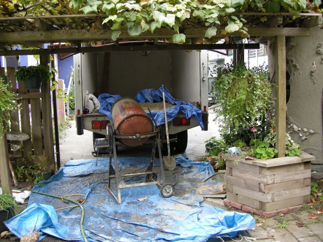 The cement mixer under the grape arbor